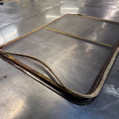 A damaged screen returned for re-meshing