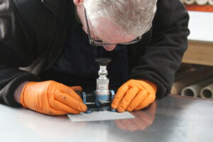 A wire mesh expert inspecting fine wire mesh