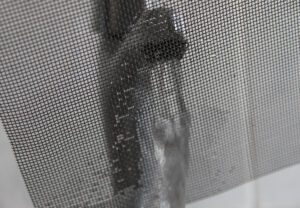 Stainless steel woven wire mesh showing water flow
