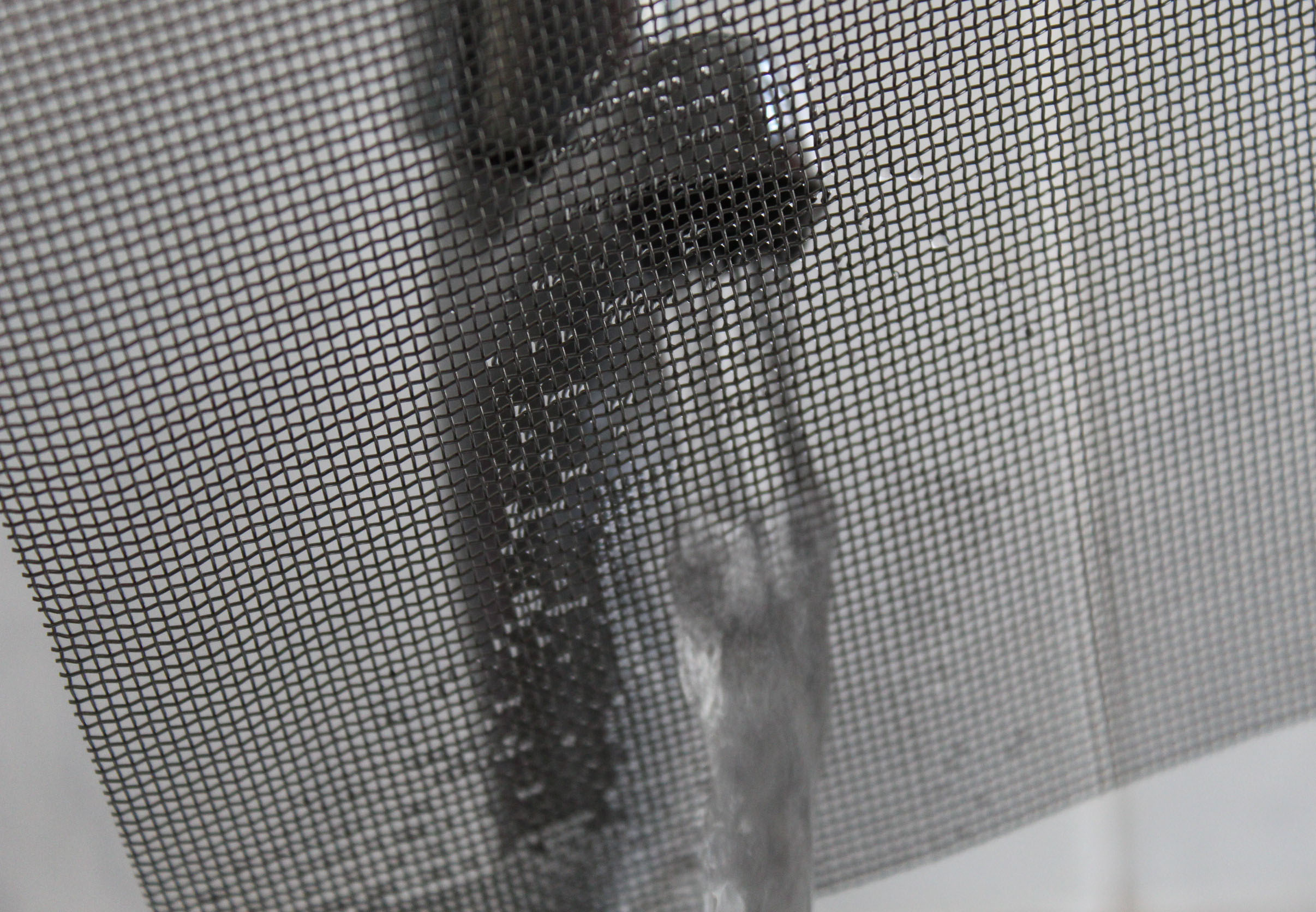 Stainless steel woven wire mesh showing water flow