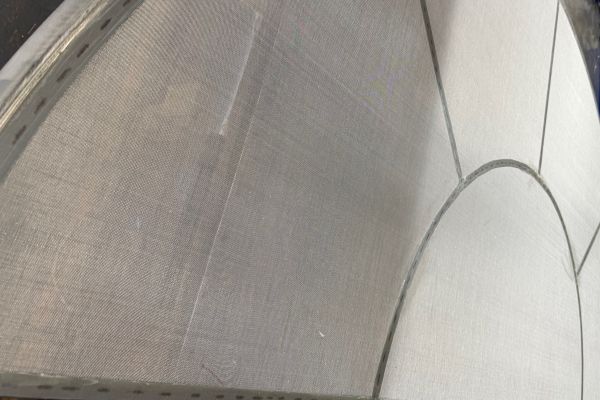 A bespoke mesh screen, sized and shaped to fit the application