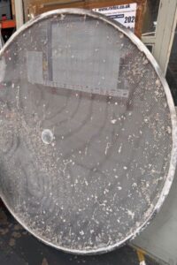 A sieving screen returned for re-meshing